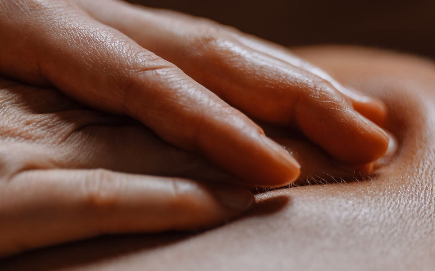 Gentle, flat hands on the skin