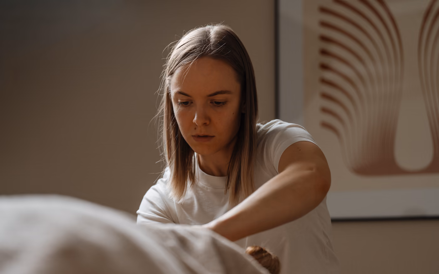 Therapist working on the back with focus