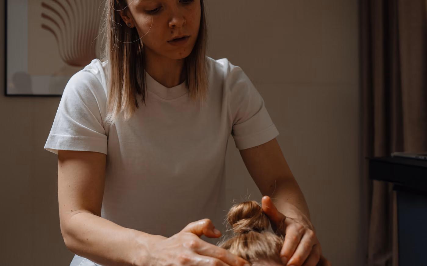 Therapist treating a client lying down