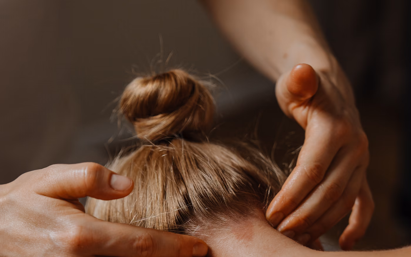 Hands on the back of the head and neck