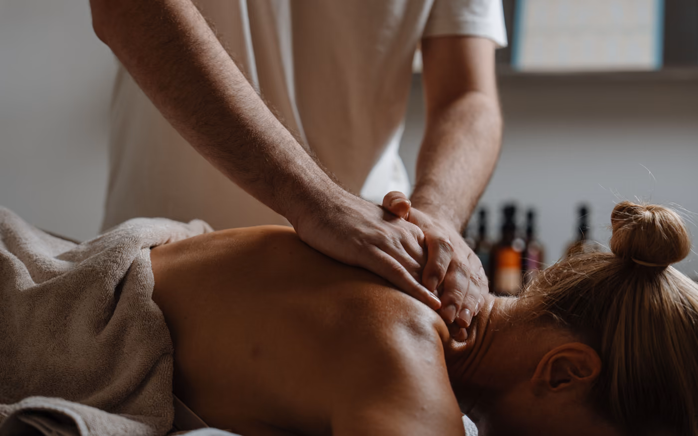 Hands on the upper back and neck